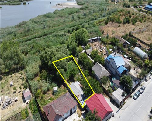 Teren de vanzare cu casa din chirpici n zona Orizontului, cu utilitati